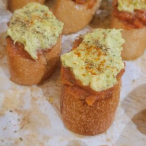 Bruschetta with dried tomato spread and avocado